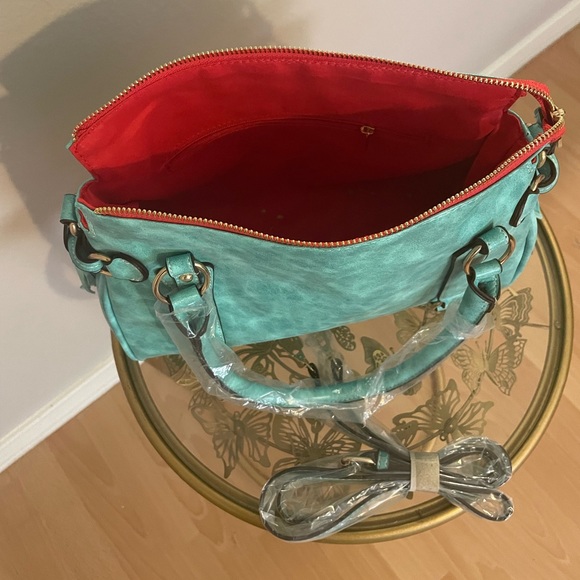 Turquoise large faux leather handbag with tassel accents. - Picture 3 of 4